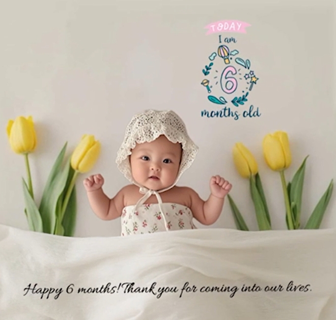 LittleCam six-month baby milestone portrait with yellow tulips